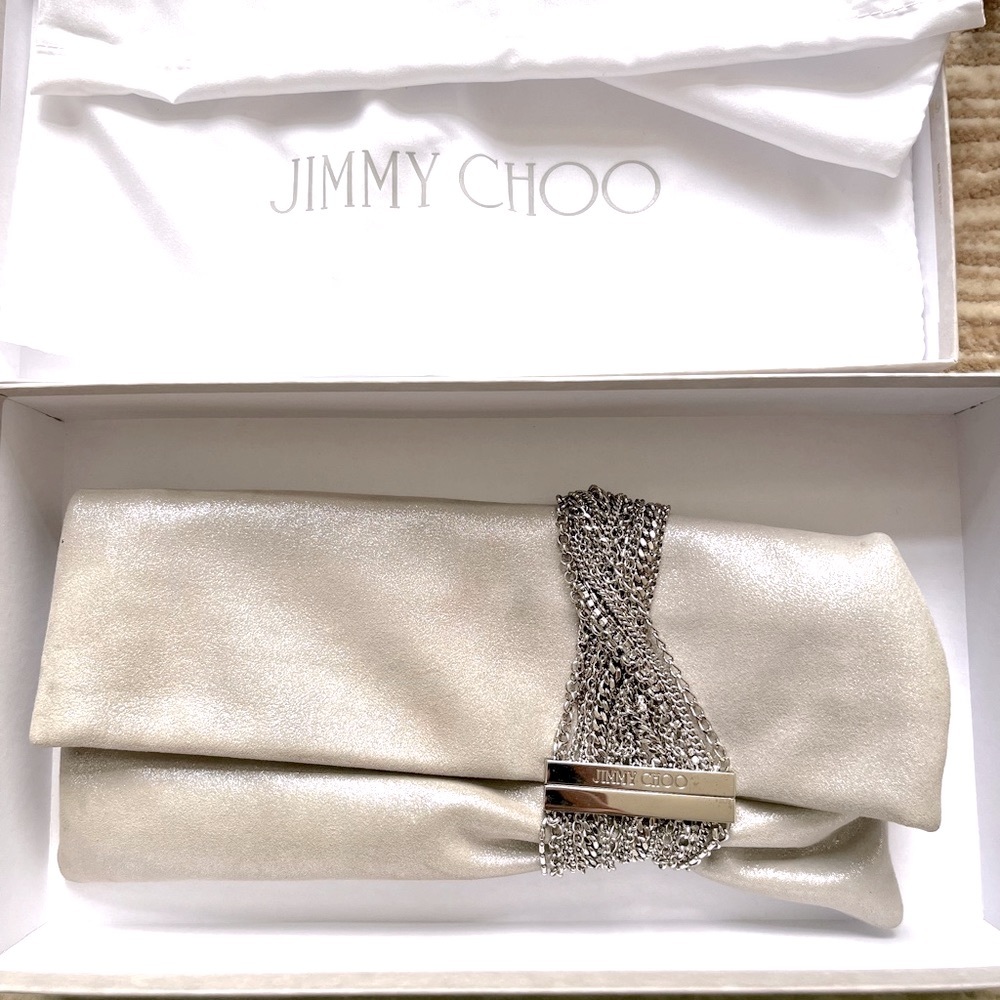 Jimmy Choo silver clutch. Used once, perfect condition with duster and box.
